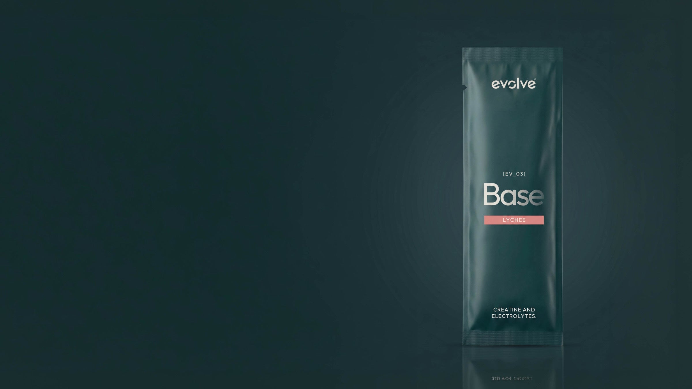 An evolve® Base sachet, creatine and electrolytes, standing upright on a deep green surface